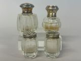 two salt and pepper shakers sitting on a table