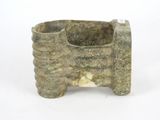 a stone planter that is sitting on a white surface