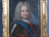 un vieux tableau représentant un homme en armure, dans un cadre doré