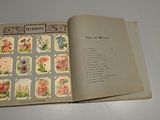 an open book with a picture of flowers on it