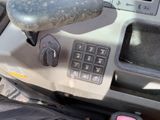 a close up of a car dashboard with a remote control