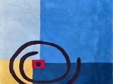 une image représentant un tapis orné d'un motif en spirale