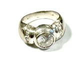 a close up of a ring with a diamond on it