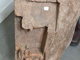 a large piece of wood that has been carved into a bench
