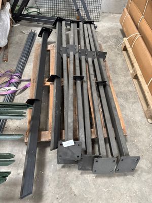 a lot of metal and wood items on the floor