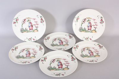 six plates with different designs on them sitting on a table