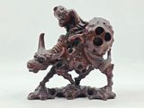 an image of a figurine of a man riding on a horse