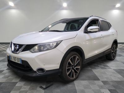 a white nissan qx - v parked on a checkered floor