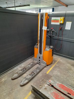 a fork lift truck parked in a garage