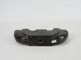 a small black object that is on a white surface