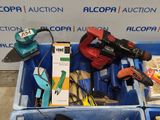 a blue box with tools in it sitting on the floor