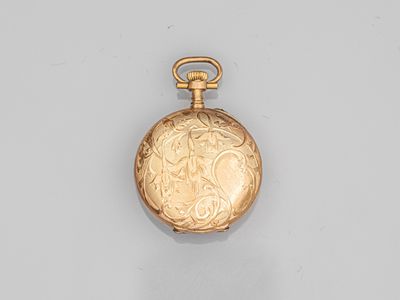 an image of a gold pocket watch on a white surface