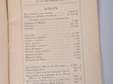 an open book with a list of items on it on a table