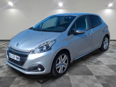 a silver car is parked in a room with a checkered floor