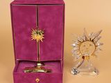 purple box with a pen and a glass sunburst in it