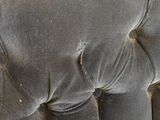 an image of a close up view of a velvet upholstered chair