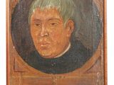 portrait d'un jeune garçon portant une chemise à col noir et aux cheveux verts