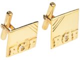deux boutons de manchette en or sertis de diamants, sur fond blanc