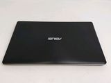 the back of a black laptop computer sitting on top of a white table