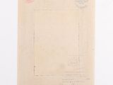 an old envelope with a stamp on it sitting on top of a table