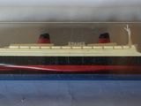 a small model of a ship in a clear case