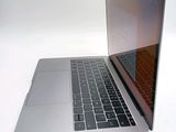 a close up of a laptop computer on a white surface