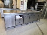 a large kitchen with stainless steel appliances in it