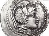 a close up of a coin with a woman ' s face on it