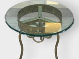 a glass table with a metal base and a glass top