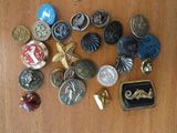 a lot of buttons on a table with a ring