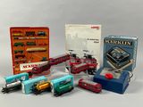 a lot of toy trains that are sitting on a table