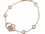 a close up of a bracelet on a white background