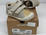 a box with a pair of baby shoes on it