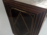 a small wooden table with a glass top on a table