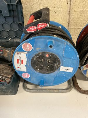 many different types of hoses and other tools sitting on a table
