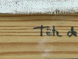 a close up of a piece of wood with writing on it