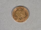 a gold coin with a picture of a horse on it