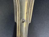a close up of a spoon on a table with a black background