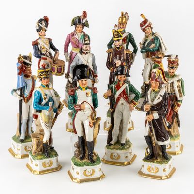 seven figurines of soldiers in different colors and sizes