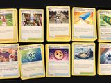 pokemon trading card game set with a lot of cards on a table