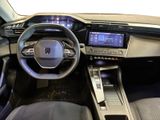 the interior of a car with a steering wheel, dashboard, and dashboard controls