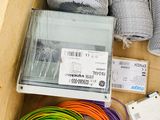 a wooden box filled with assorted wires and wires