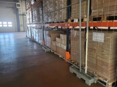 many boxes stacked on a pallet in a warehouse