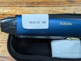 an image of a babylis clipper sitting in a case on a table