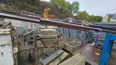 a crane that is sitting on top of a pile of metal