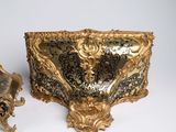 two pieces of art that are sitting on a table
