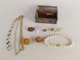 a box that has a bunch of jewelry on it