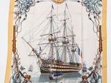 an image of a square scarf with a ship on the front of it