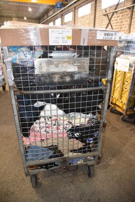 a large metal cage with a bunch of items inside of it
