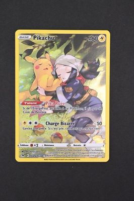 a close up of a pokemon card on a black surface